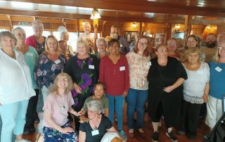 Group of carers on a retreat smiling