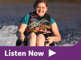 Danielle water skiing on an accessible sit ski